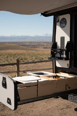 RV rental with a pull-out TigerMoth outdoor kitchen from Taxa Outdoors, ideal for camping adventures.