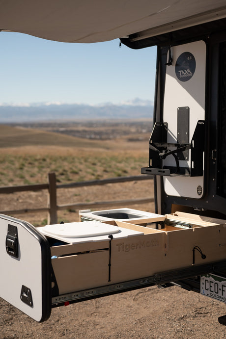 RV rental with a pull-out TigerMoth outdoor kitchen from Taxa Outdoors, ideal for camping adventures.