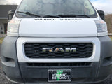 Front of a white Ram ProMaster van, popular for RV rental, showing its grille and "Vermont STRONG" plate.