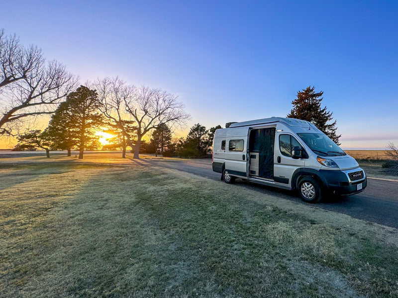 Scenic RV rental: Silver camper van on road — photo 1