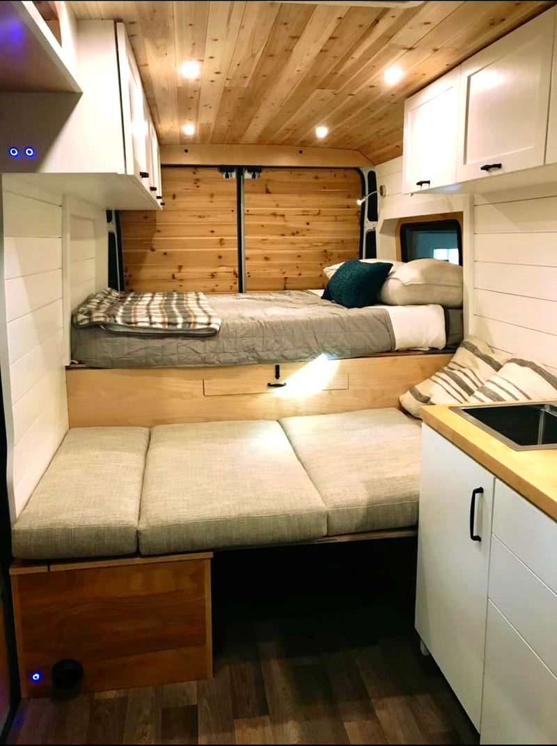  and under-bed storage optimize space.|Interior view of an rv rental showing front cab — photo 4