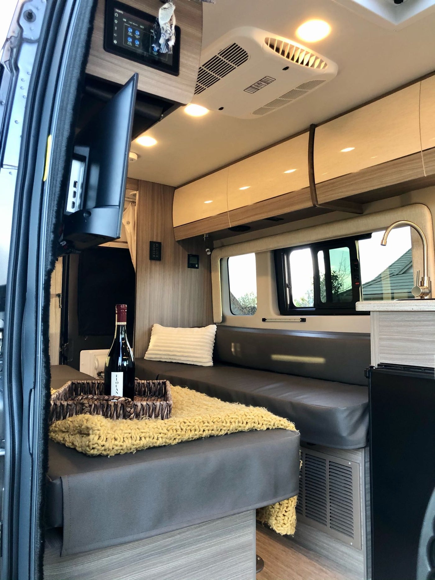  parked outdoors. Perfect for your next rv rental.|View inside a modern rv rental with kitchenette — photo 6