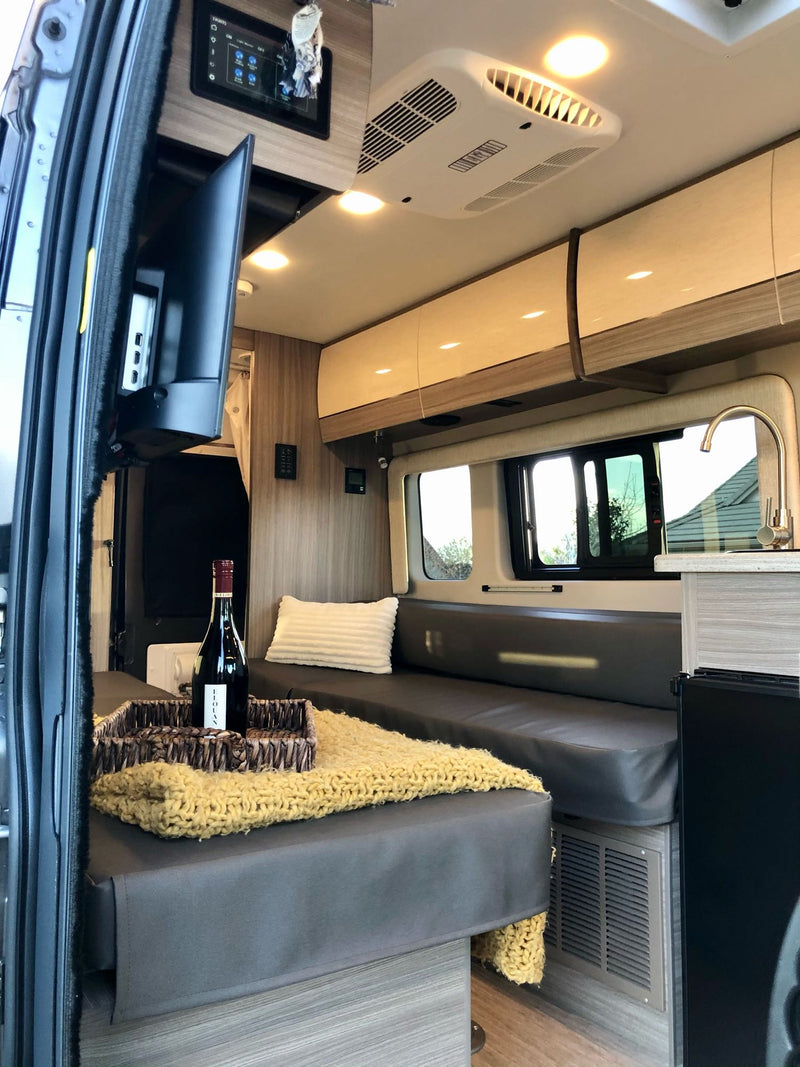  parked outdoors. Perfect for your next rv rental.|View inside a modern rv rental with kitchenette — photo 6
