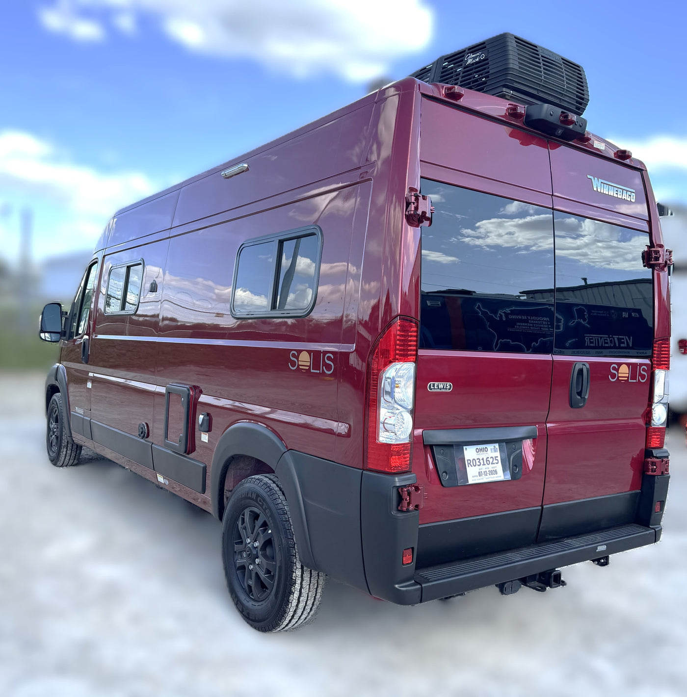 This burgundy Winnebago Solis camper van with rooftop AC and Ohio plate is perfect for your next rv rental trip. — photo 4