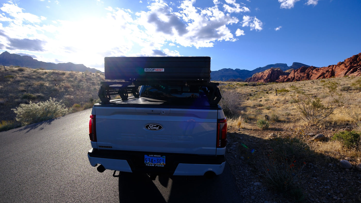 Sunny desert adventure: A Ford F-150 with a Roofnest rooftop tent, ready for your next rv rental camping trip. — photo 7