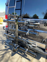 Rear of an RV rental with a large, black Kuat ski/snowboard carrier system. Ready for outdoor gear and adventures.