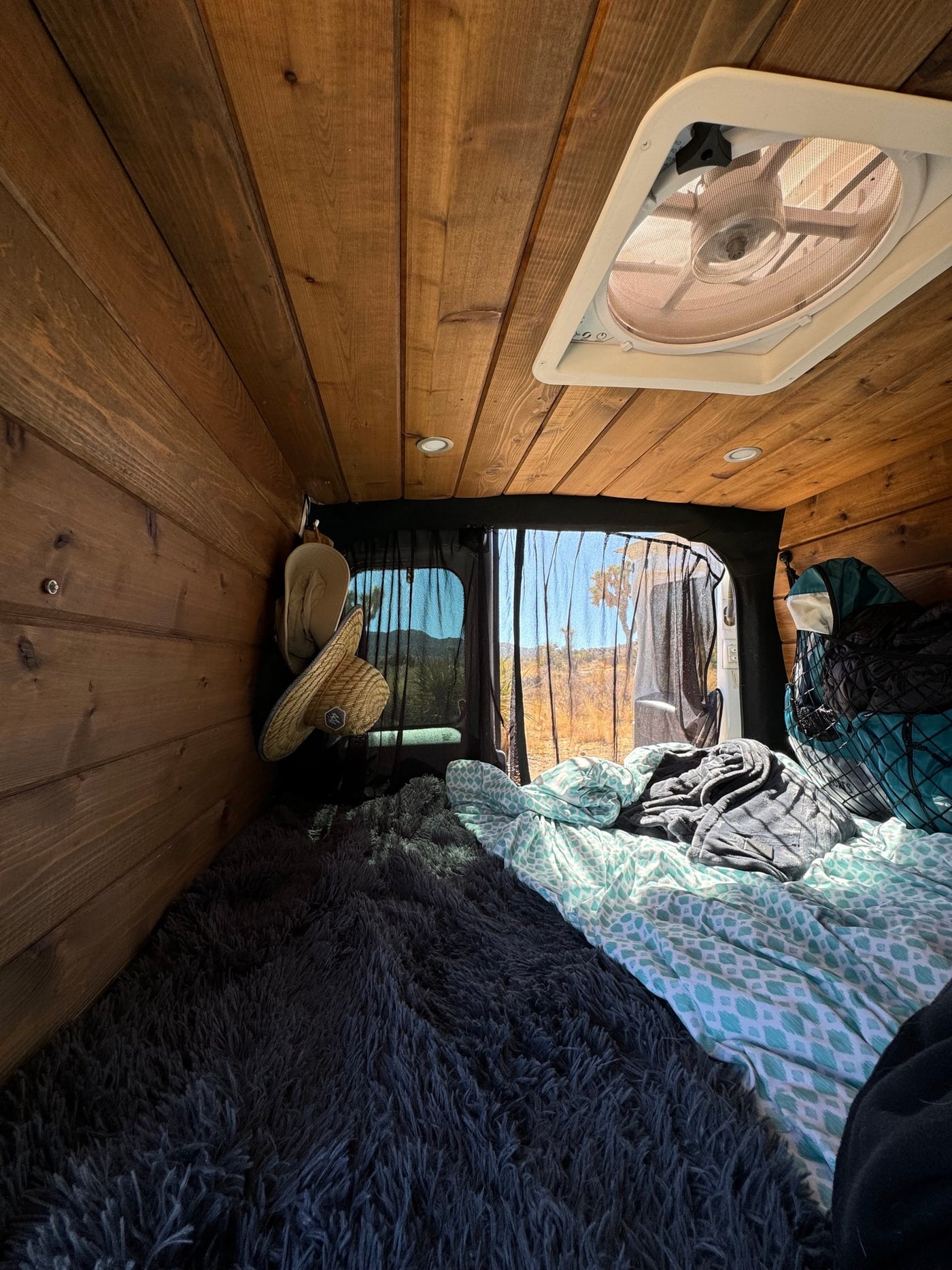  and a man at dusk under the moon.|White camper van — photo 3