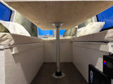 Cozy RV rental interior featuring a central dining table and comfortable bench seating, ideal for camper adventures.