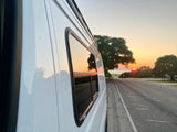 Scenic sunset reflecting on an RV rental parked roadside, a perfect travel adventure vista.
