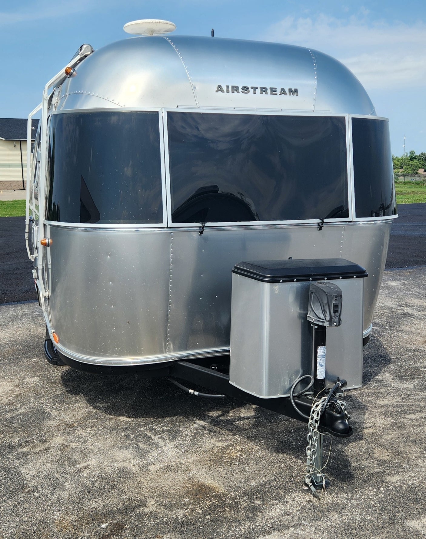 Front view of a sleek, silver Airstream RV travel trailer, perfect for your next RV rental adventure.