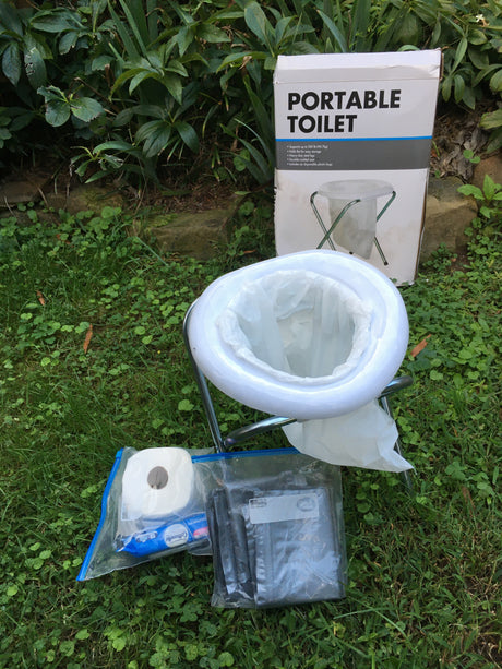 Essentials for your RV rental: a portable toilet, toilet paper, and disposal bags for outdoor adventures.
