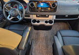 Detailed RV rental cockpit view: Mercedes-Benz dashboard, steering wheel, infotainment, and front seats.