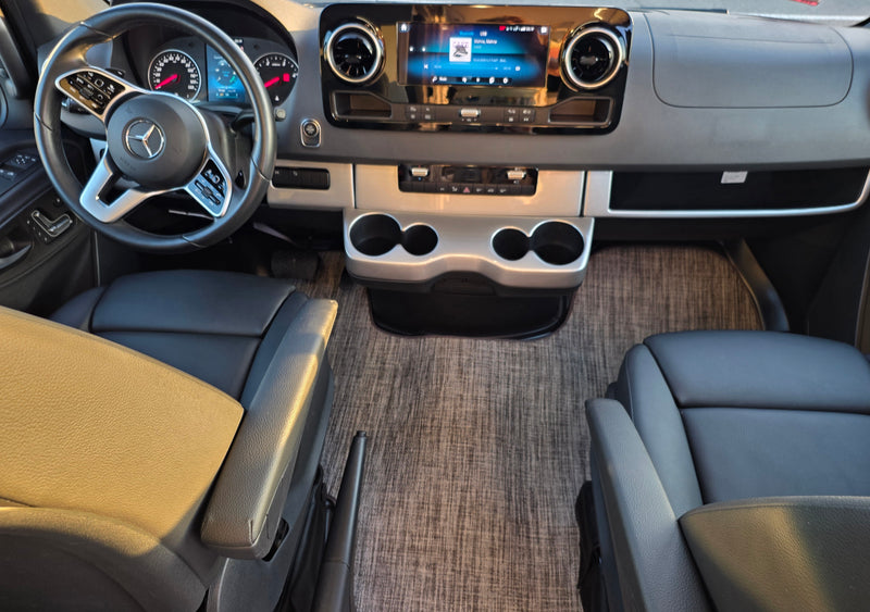 Detailed RV rental cockpit view: Mercedes-Benz dashboard, steering wheel, infotainment, and front seats. — photo 11