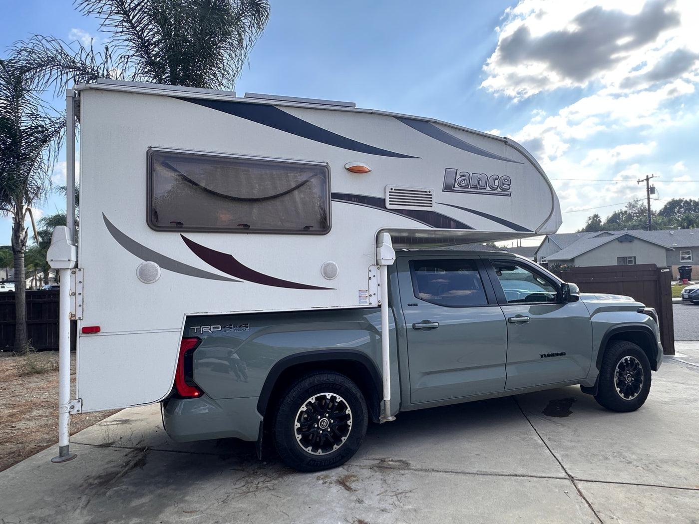  fitted with a white Lance truck camper — photo 4