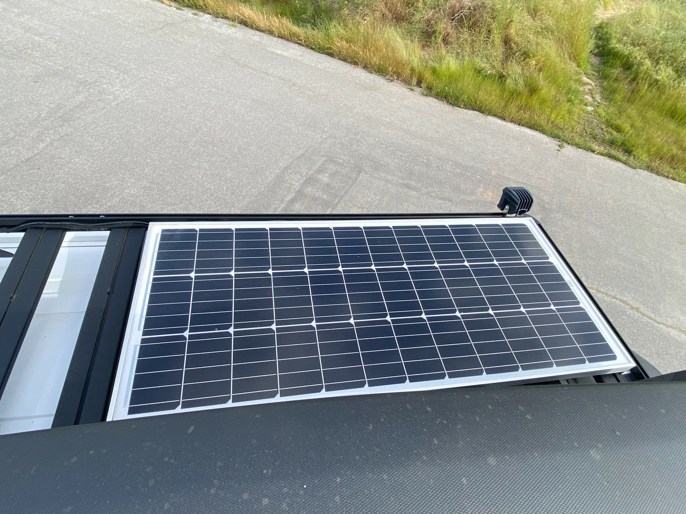 Roof view of a solar panel and light on an RV rental, providing off-grid power. — photo 7