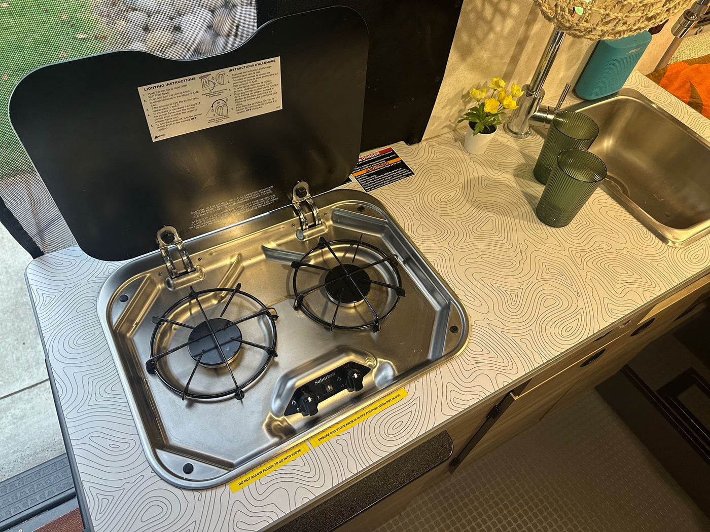  reflecting blue sky. Ideal for an rv rental.|RV rental wet bath interior: compact shower/toilet combo in white molded plastic.|RV rental interior with a desert view of Joshua trees — photo 11