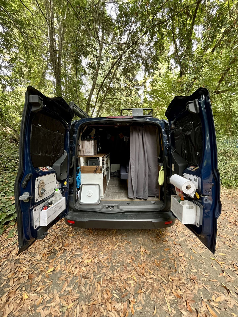  ideal for an RV rental. Rear doors open to reveal a compact kitchen & cozy interior — photo 1