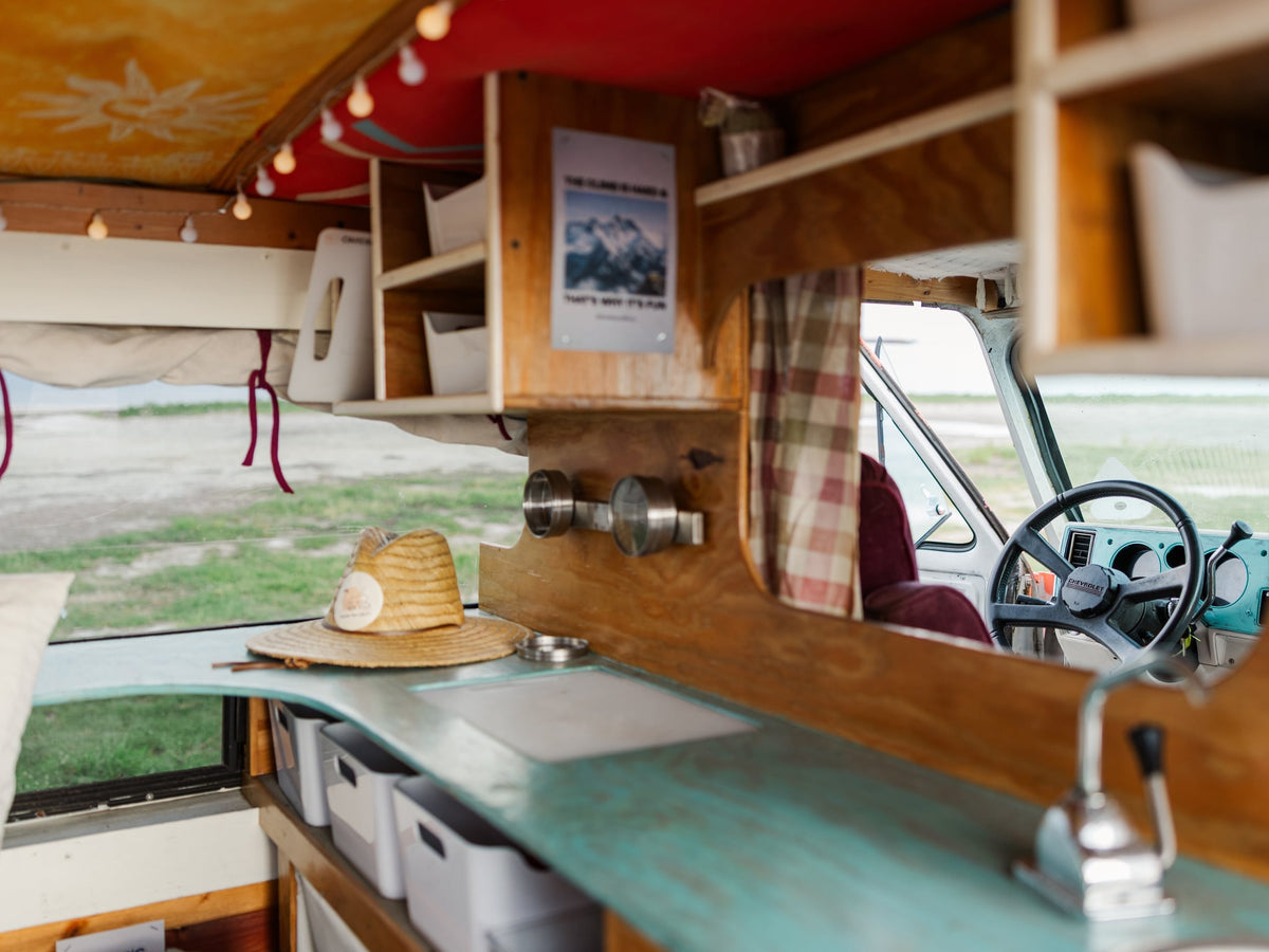  and a relaxing hammock chair.|This cozy rv rental interior features a bed — photo 19