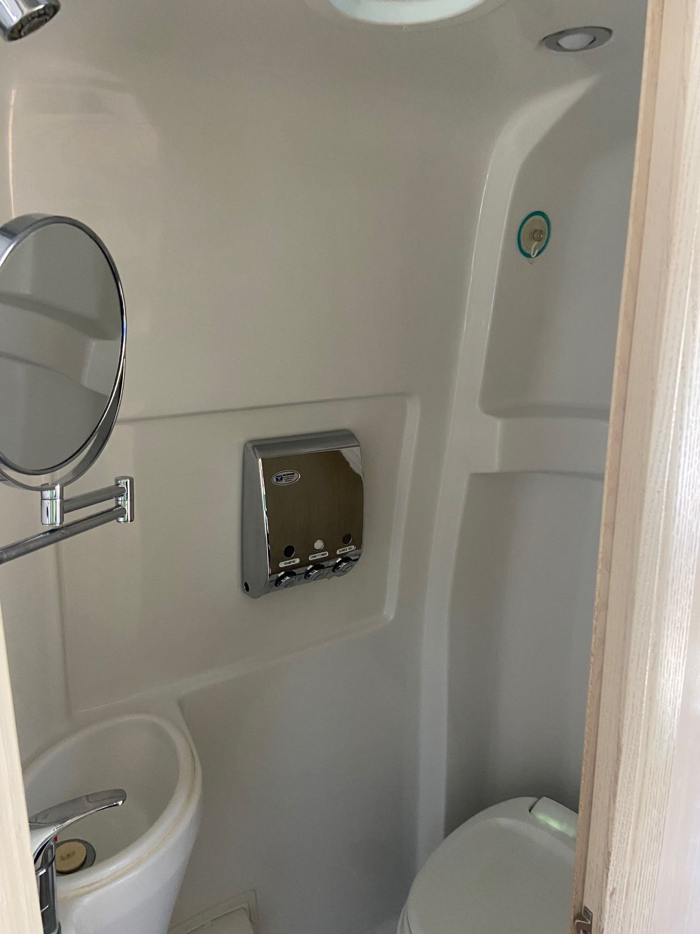  alongside comfortable cream-colored seating.|Inside an RV rental: view of the clean — photo 8
