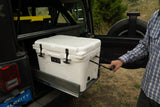 Organized Jeep adventure with an rv rental! Man pulls Yeti cooler from custom slide-out storage system.