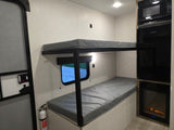 RV rental: Bunk beds, microwave, TV, fireplace, and fire extinguisher for a cozy journey.