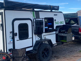 Off-road camper with outdoor kitchen & Rhino-Rack awning. Perfect for your next rv rental adventure!