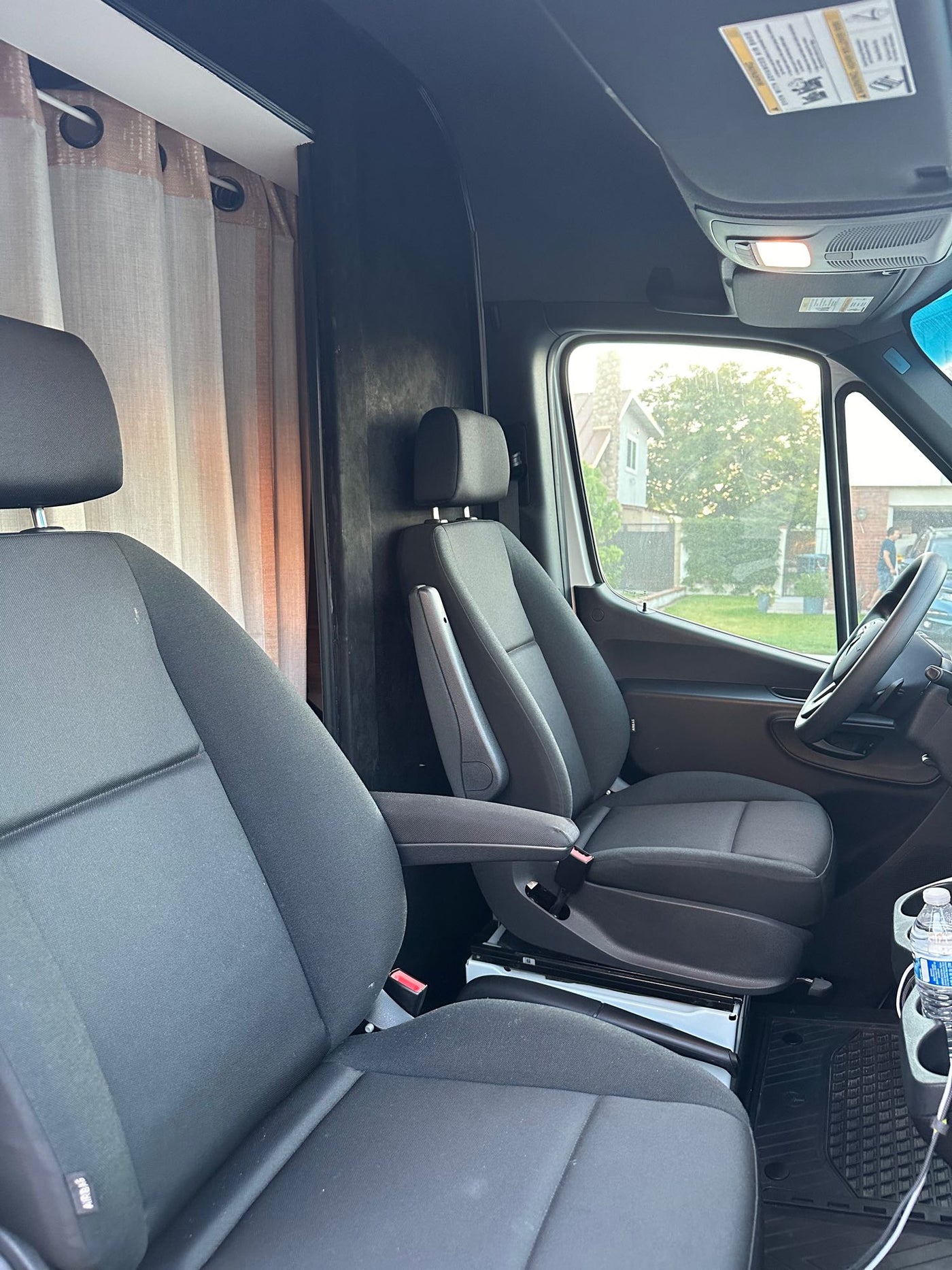 RV rental van interior: comfortable cabin with swivel front seats — photo 1
