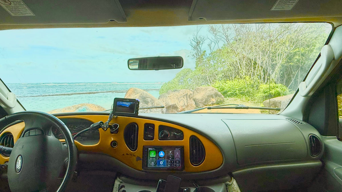  and an "aloha" sign.|Maroon high-top RV rental van — photo 13