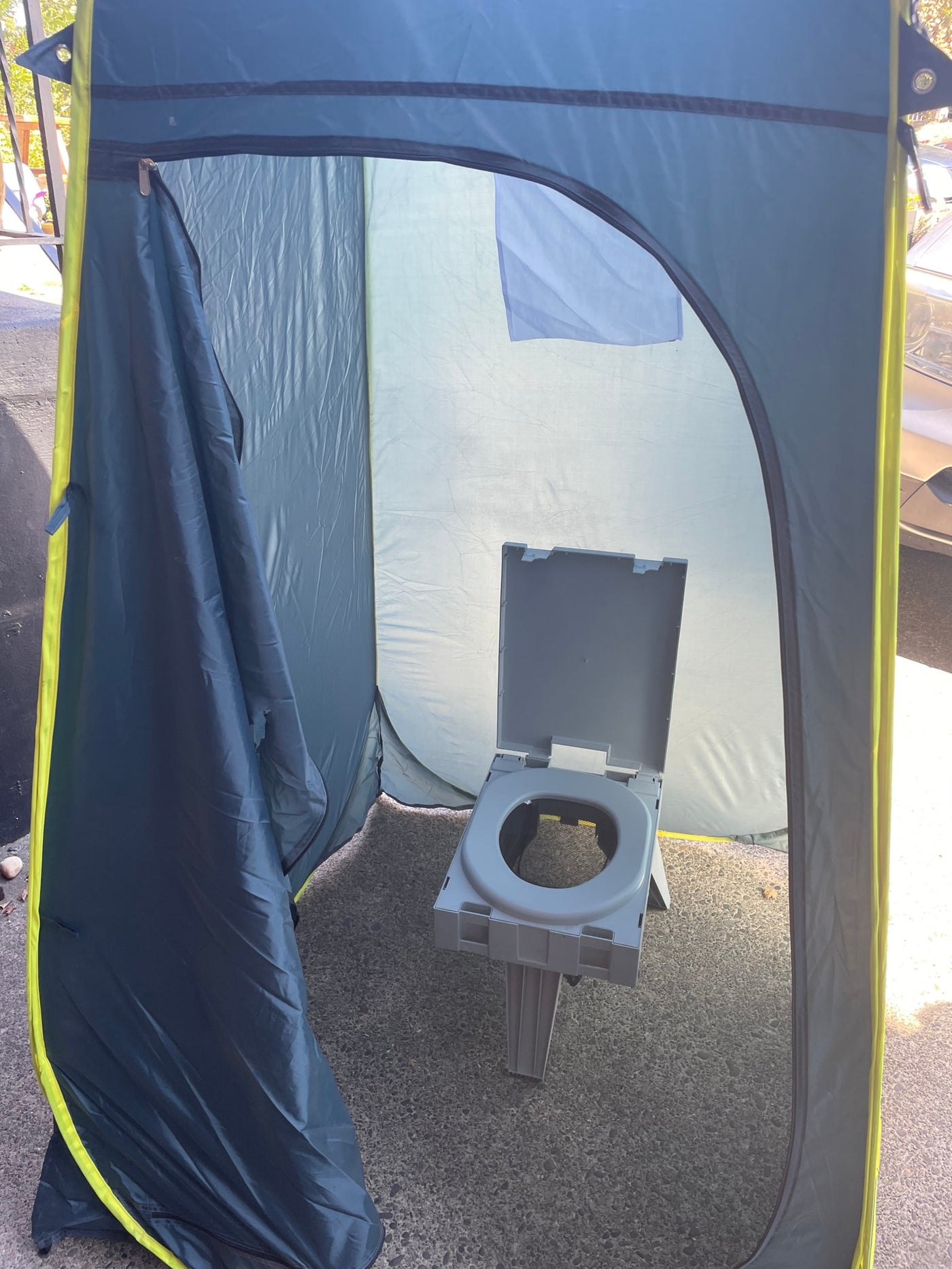 Portable toilet inside a privacy tent, perfect for RV rental and camping convenience. — photo 11