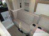 Cozy RV rental interior featuring reclinable seating, a compact wet bath, and storage cabinetry. Ideal camper travel.