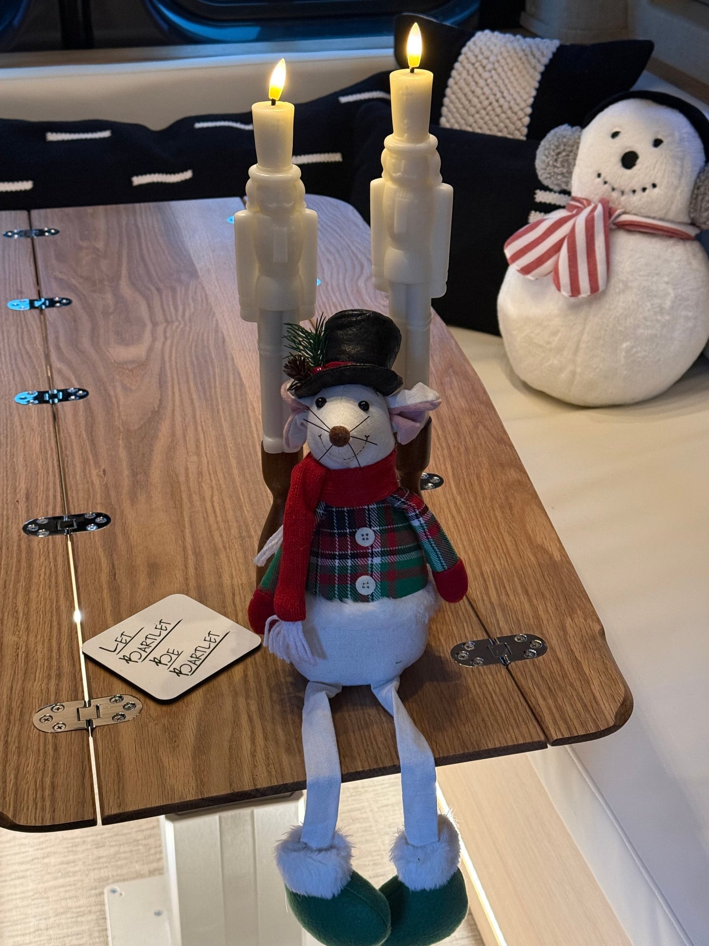  and festive Thanksgiving decor like a turkey pillow.|RV rental interior: A compact kitchen with microwave & fridge — photo 7