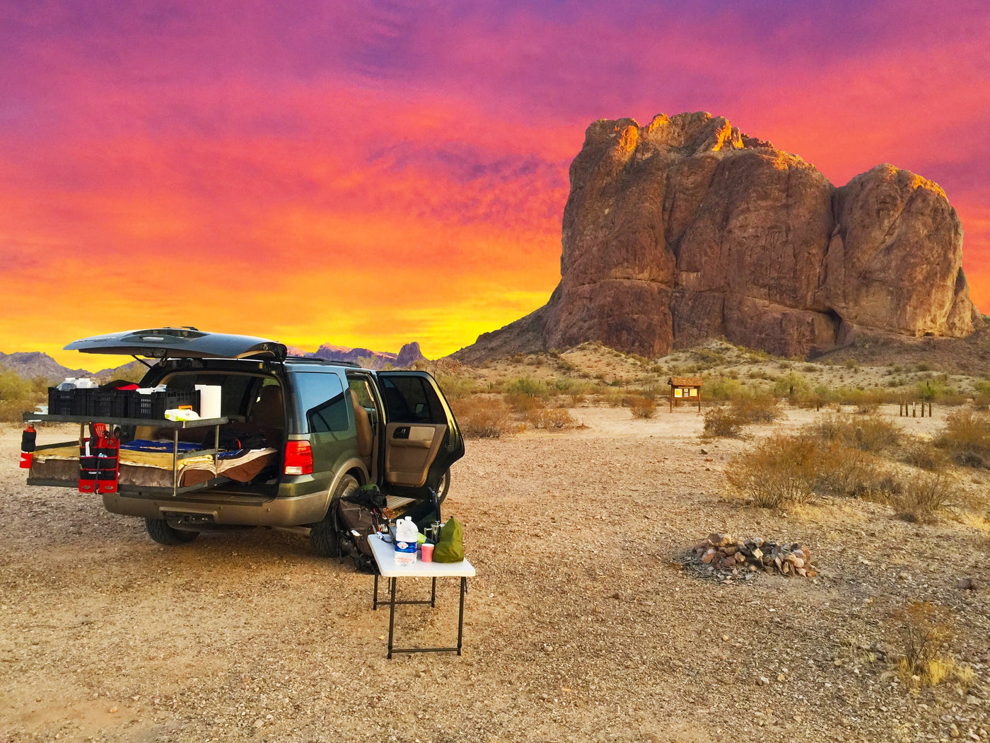 RV rental interior: A car transformed into a comfortable sleeping space with a bed — photo 6