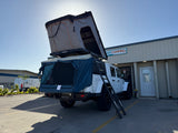 White Jeep Gladiator with a rooftop tent and annex set up for rv rental at Easy Camping Maui. Ready for adventure!
