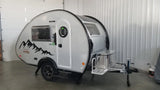 Modern silver teardrop camper, a perfect RV rental for your next adventure.