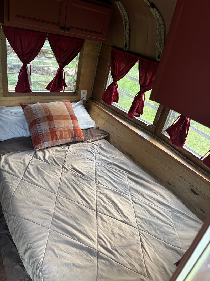  and warm wood paneling.|Inside an RV rental: Dinette — photo 12