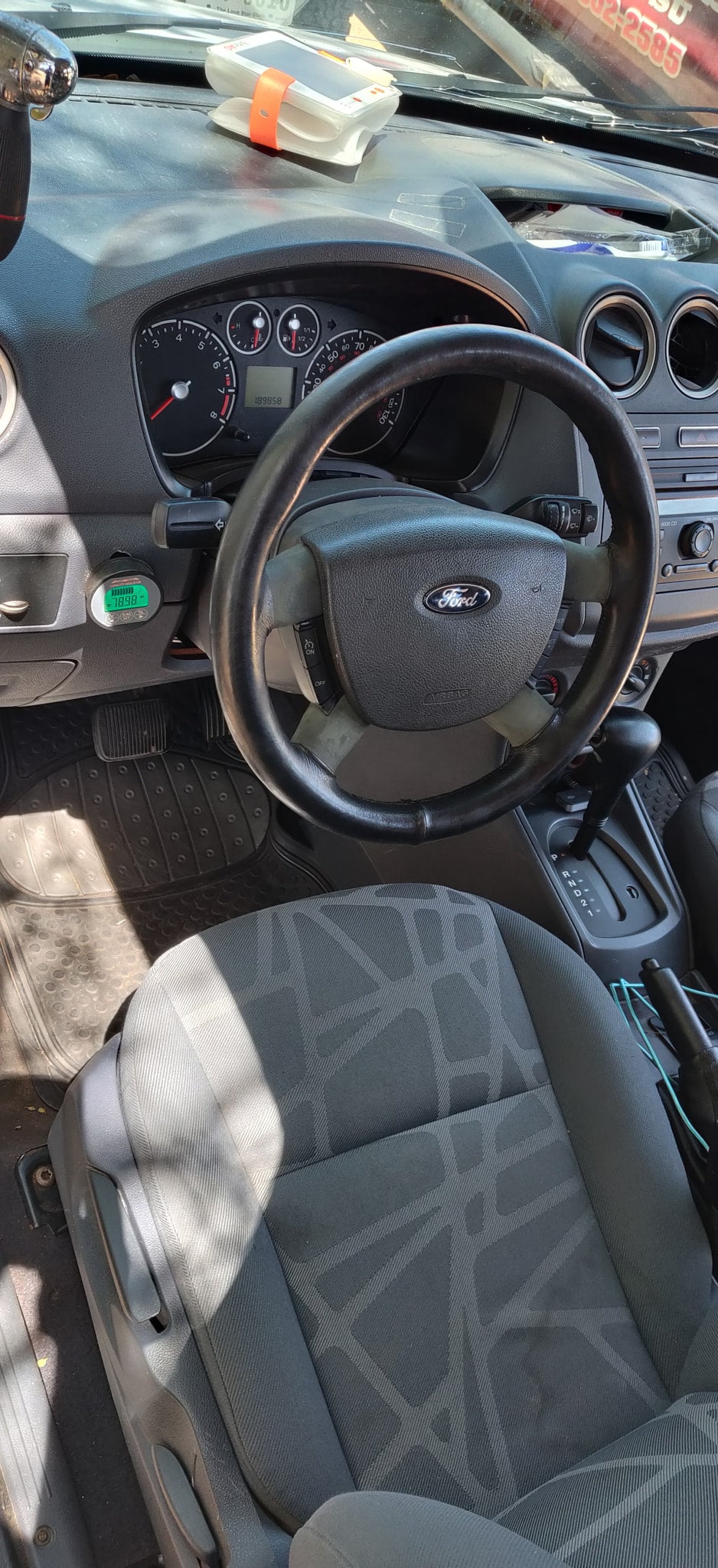 Ford vehicle interior, perhaps from an RV rental, featuring dashboard, steering wheel, and automatic shifter. Mileage: 189858. — photo 16