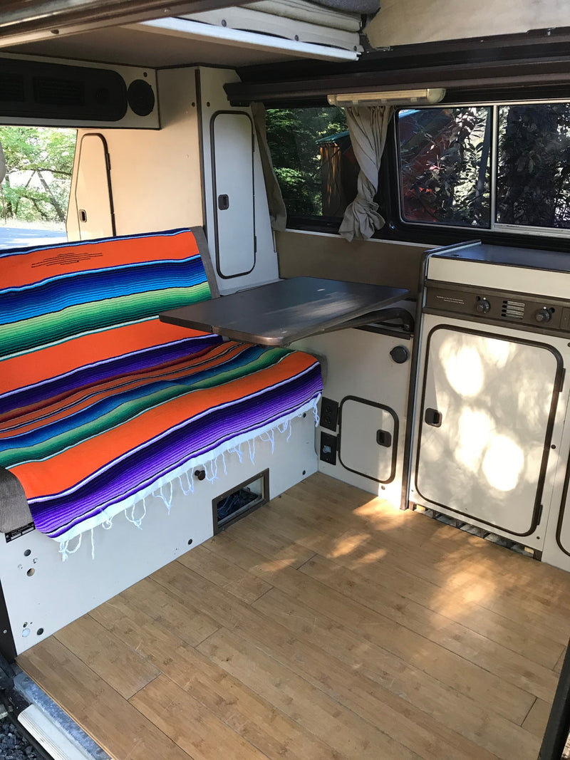  and wood flooring. Ready for your next trip!|A brown pop-top camper van — photo 9