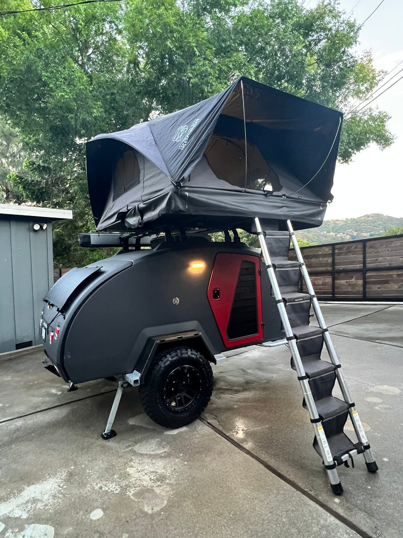  this rv rental teardrop camper reveals its illuminated outdoor kitchen with a sink — photo 6