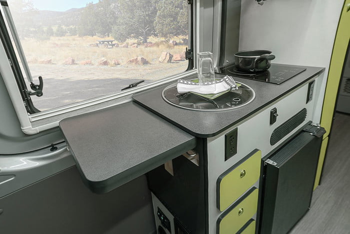  and pump switches in the rear.|Heavy-duty BFGoodrich All-Terrain tire and black Method wheel on an RV rental — photo 15