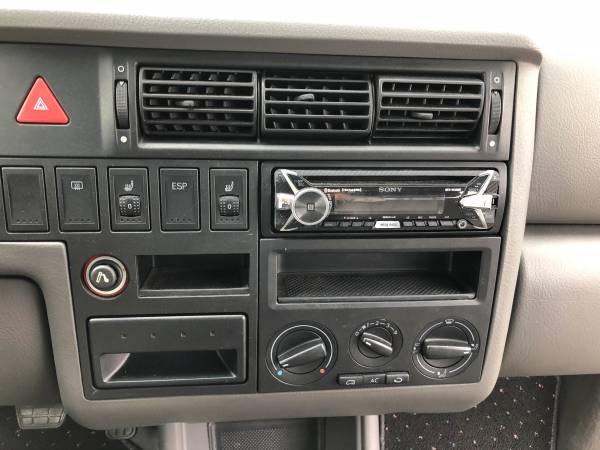 RV rental interior dashboard featuring a Sony car stereo, manual climate controls, hazard light, and heated seat buttons. — photo 9