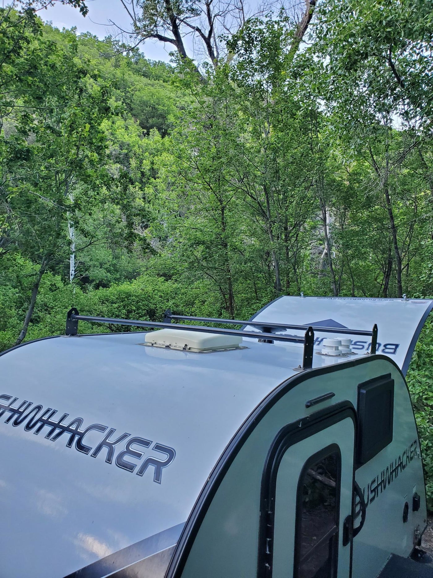  and an organized shelf of camping essentials.|RV rental interior: WFCO battery detection panel — photo 15