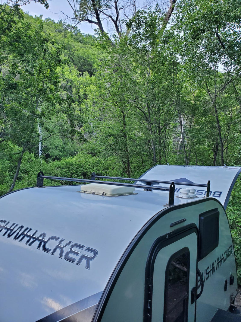  and an organized shelf of camping essentials.|RV rental interior: WFCO battery detection panel — photo 15