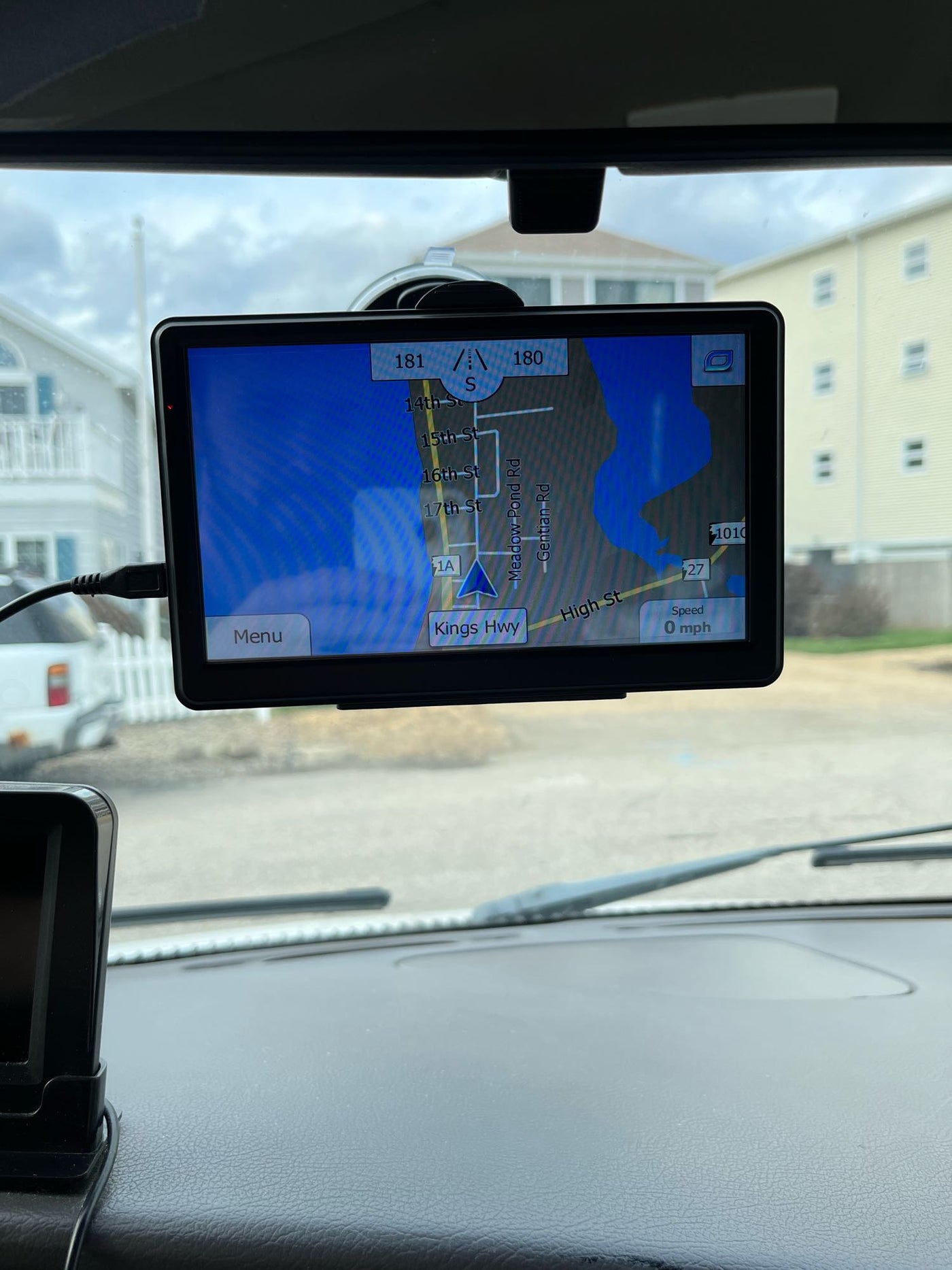  parked on a street.|Interior view of an RV rental van