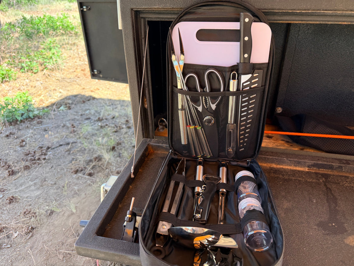  with utensils nearby.|RV rental portable kitchen kit: Organized with knives — photo 5