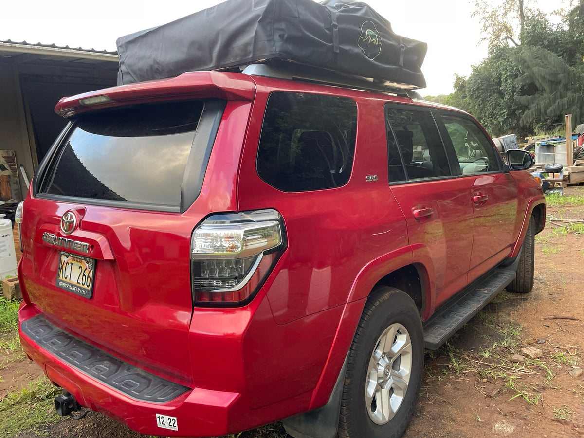 Explore with this red Toyota 4Runner RV rental, featuring a rooftop tent for versatile camping adventures. — photo 3