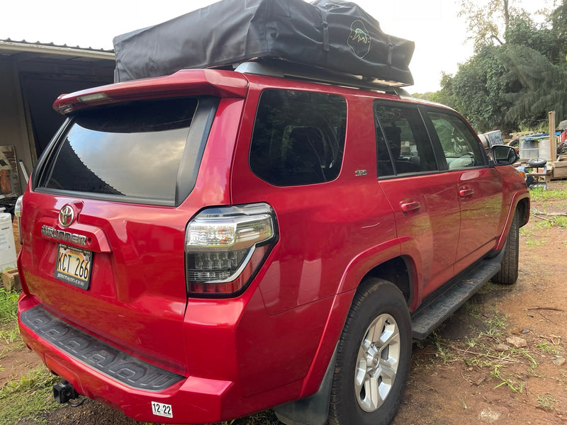 Explore with this red Toyota 4Runner RV rental, featuring a rooftop tent for versatile camping adventures. — photo 3