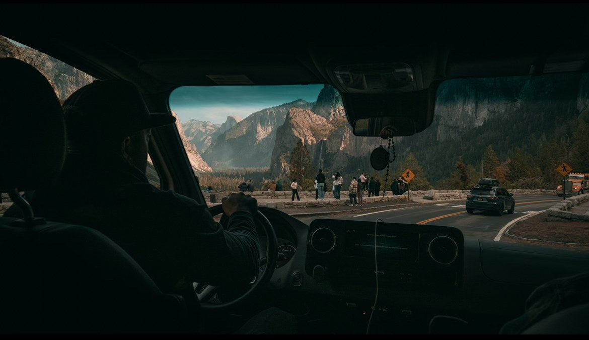  seen from a cozy camper.|RV rental: A Winnebago Revel van sits on a shaded road in a majestic redwood forest — photo 12