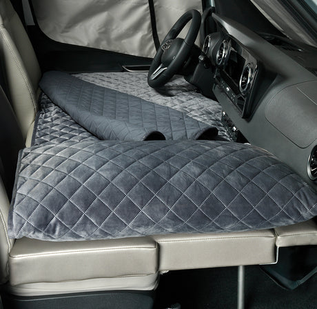 Plush, quilted sleep mats transform an RV rental into a comfortable resting space, ideal for travel.