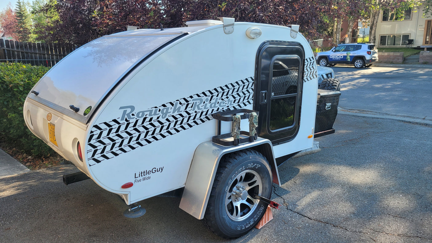This white LittleGuy teardrop RV rental, a Rough Rider, is ready for your next camping adventure.