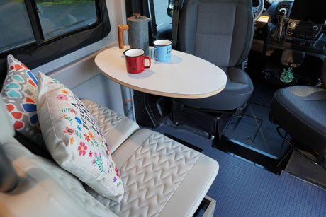 Enjoy morning coffee in this comfy RV rental! Features a dinette, stylish cushions, and swivel front seats.